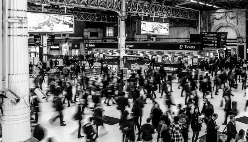 Busy train station black and white image