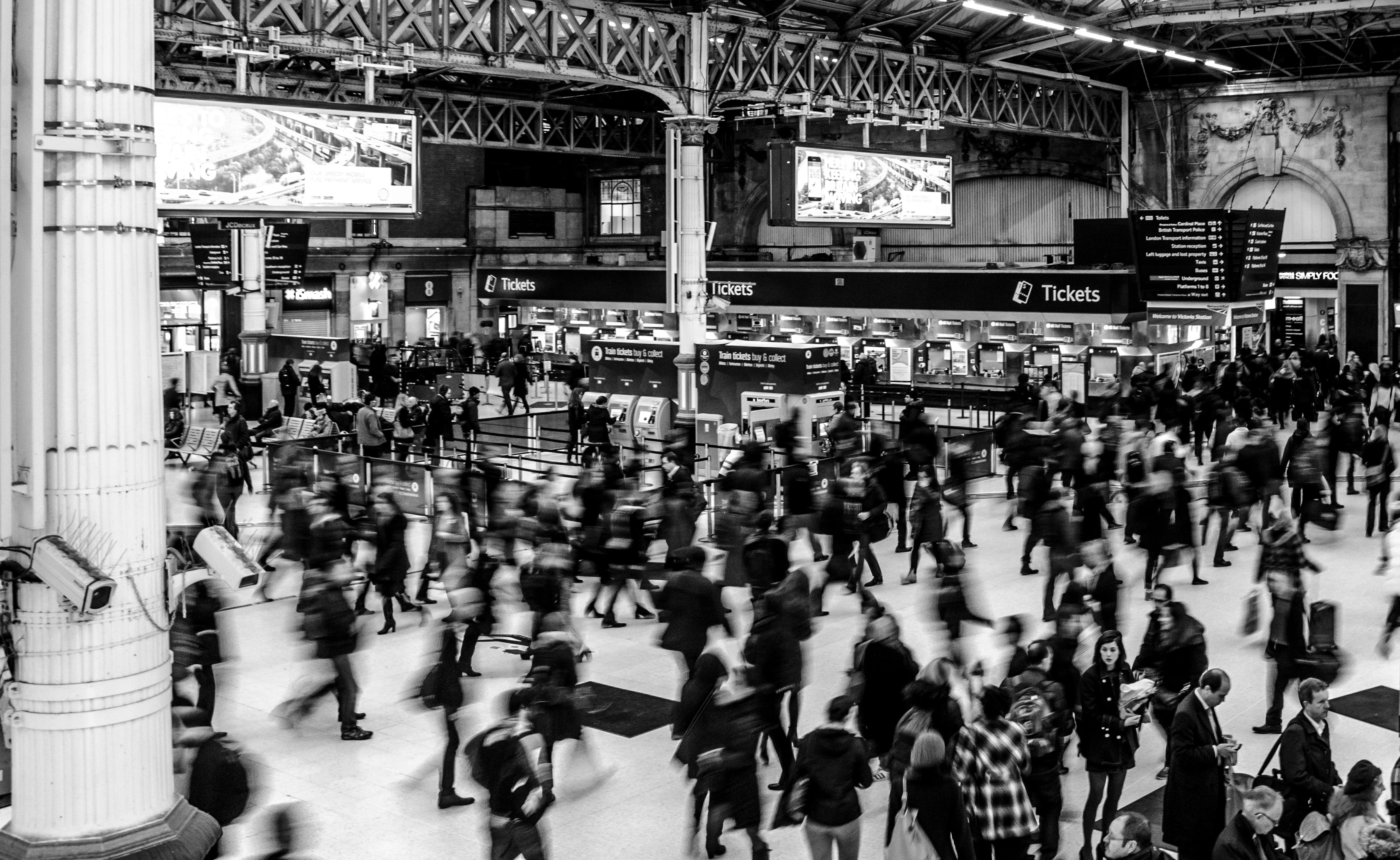 Busy train station black and white image